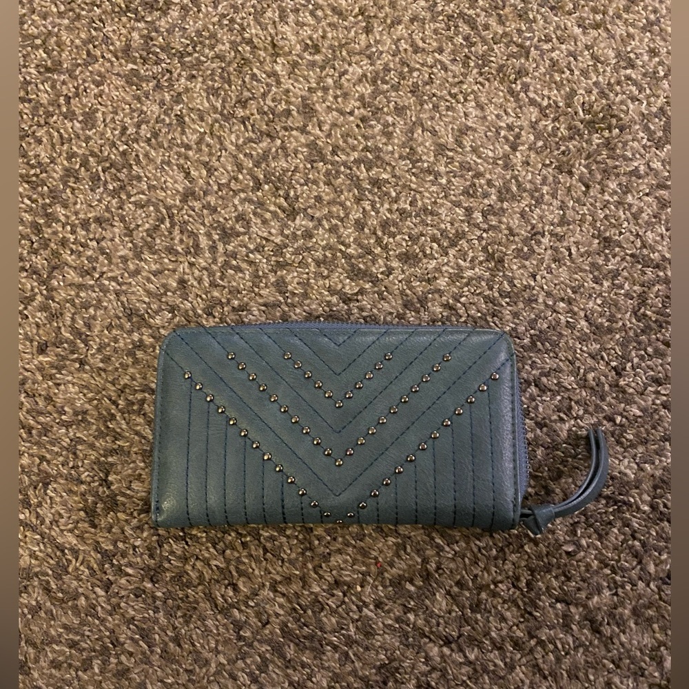 Blue wallet with gold stud design.